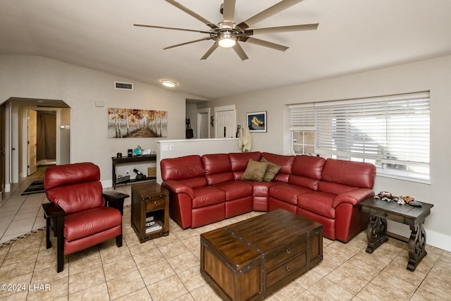 living room with light tile patterned flooring, lofted ceiling, and ceiling fan