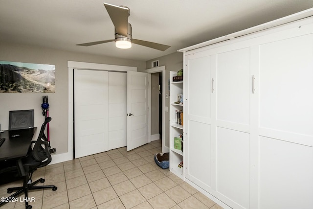 tiled home office with ceiling fan