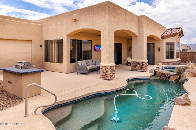 view of pool featuring an outdoor living space, an in ground hot tub, and a patio