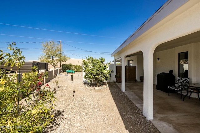 view of yard with a patio area and a fenced backyard