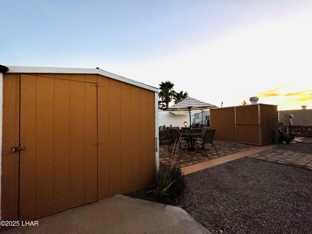 view of outdoor structure at dusk