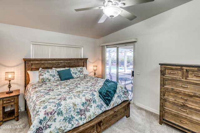 carpeted bedroom featuring ceiling fan, vaulted ceiling, and access to outside