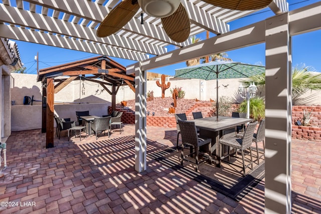 view of patio featuring a pergola and a gazebo