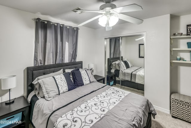 carpeted bedroom with ceiling fan and a closet