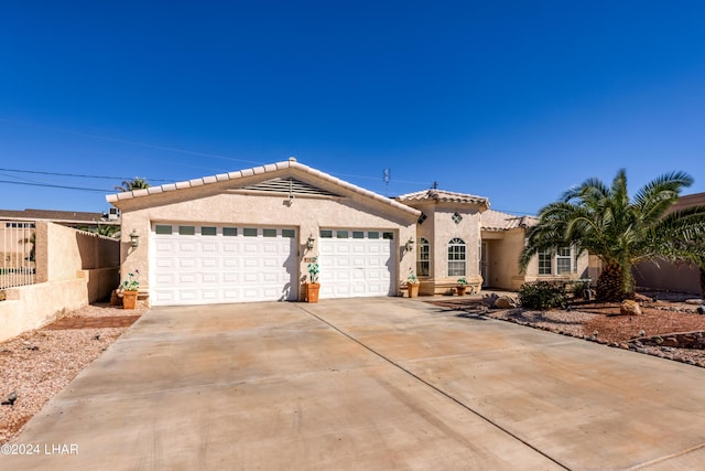 view of front of property with a garage