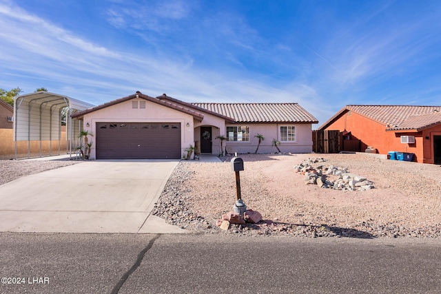 view of front of house featuring a garage and a carport