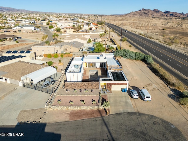 birds eye view of property featuring a mountain view