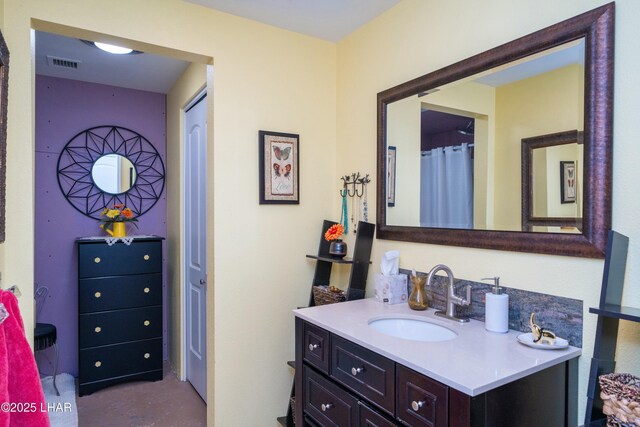 bathroom with visible vents, concrete flooring, and vanity