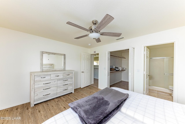 bedroom featuring connected bathroom and ceiling fan