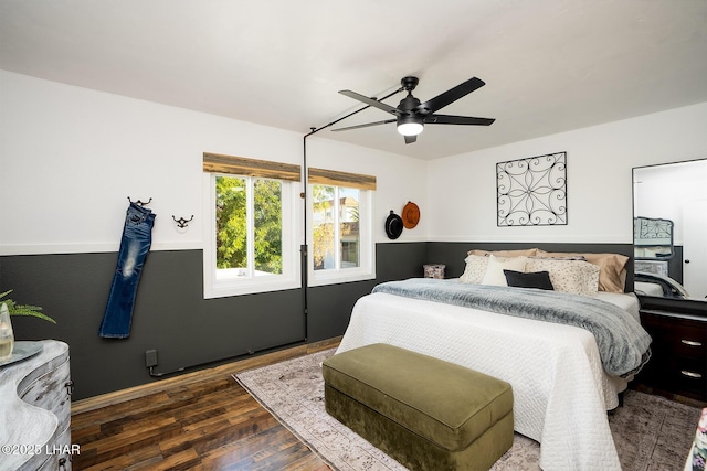 bedroom featuring dark wood-type flooring and ceiling fan