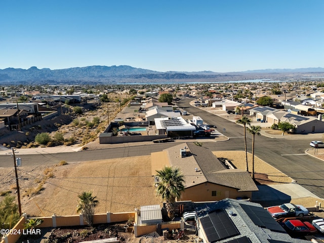 birds eye view of property featuring a mountain view