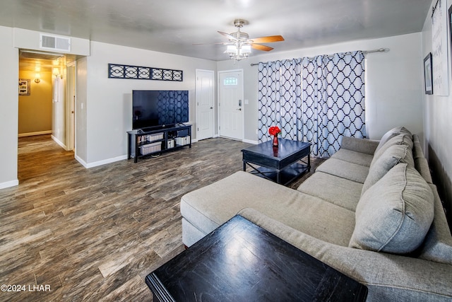 living room with hardwood / wood-style flooring and ceiling fan