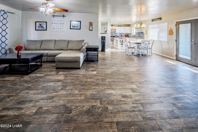 living room featuring dark wood-type flooring and ceiling fan