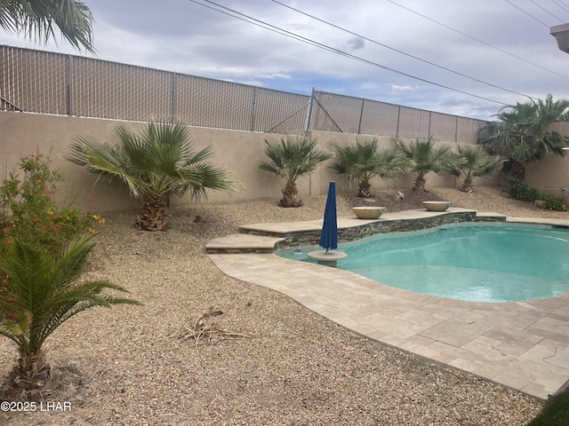 view of pool featuring a fenced in pool and a fenced backyard