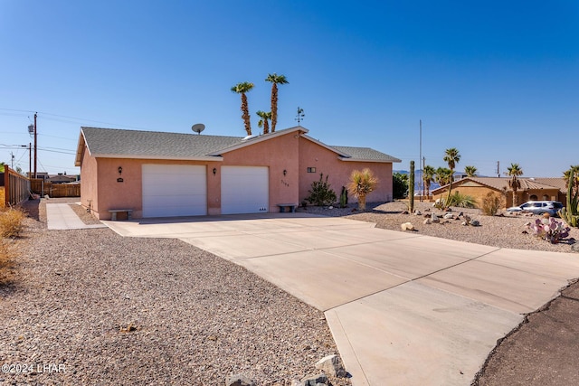 single story home featuring a garage