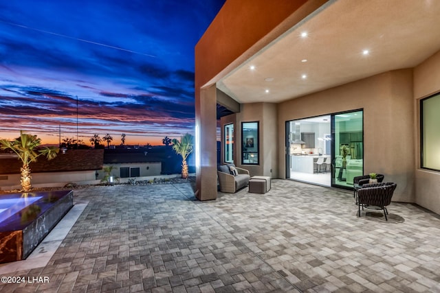 view of patio terrace at dusk