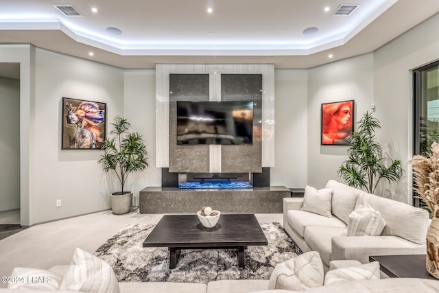 living room with a tray ceiling