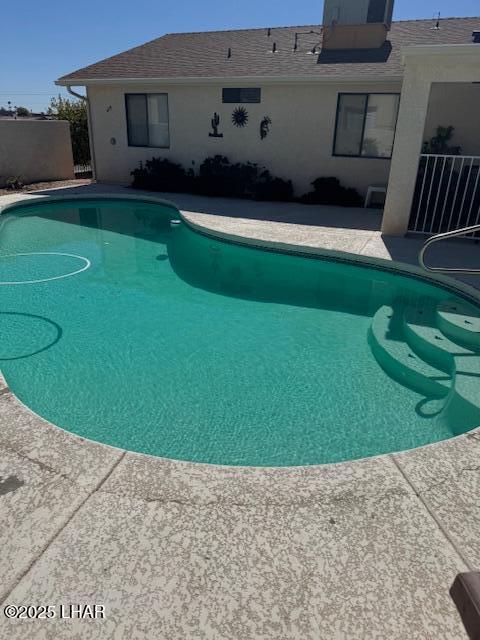 view of pool with a fenced in pool and a patio area