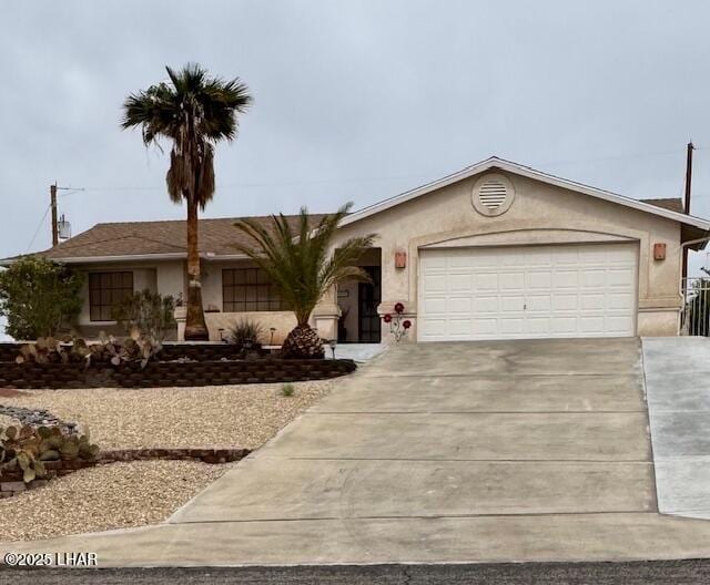 ranch-style house with stucco siding, driveway, and an attached garage