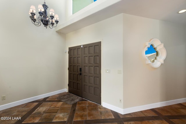 foyer featuring a notable chandelier and a high ceiling