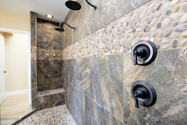 bathroom with tiled shower