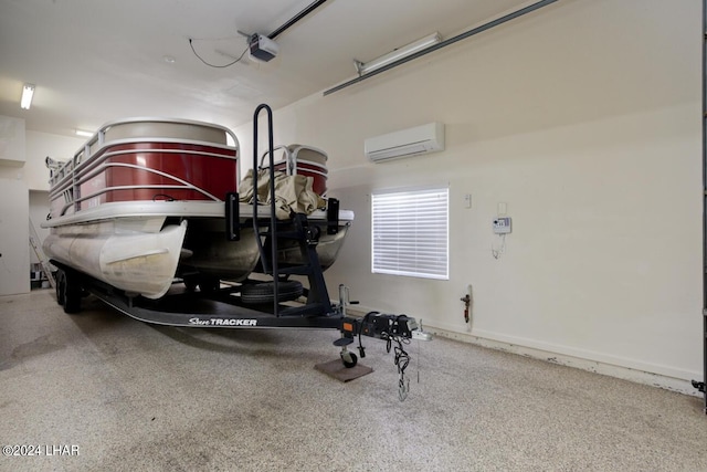 garage with a garage door opener and an AC wall unit