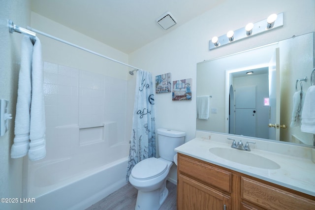 bathroom with shower / tub combo, toilet, wood finished floors, and vanity