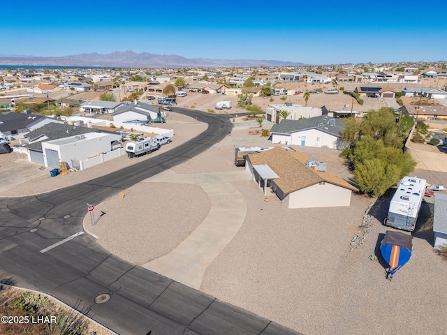 birds eye view of property with a mountain view and a residential view