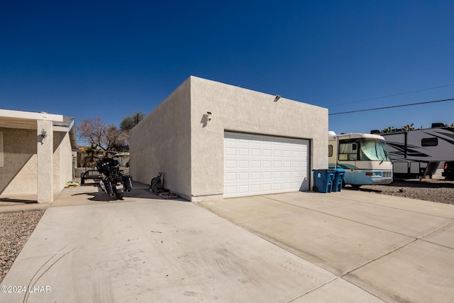 view of side of property featuring a garage