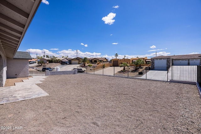 view of yard featuring a residential view and fence