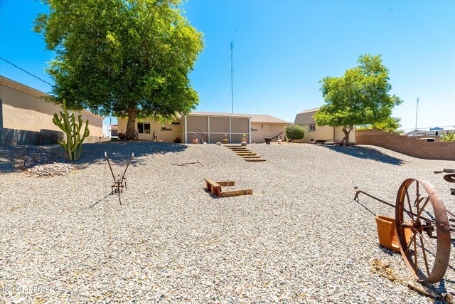 3841 Big Horn Dr, Lake Havasu City, AZ 86406 - fenced backyard with a sunroom and an outdoor structure