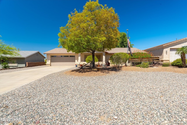 3841 Big Horn Dr, Lake Havasu City, AZ 86406 - view of front facade featuring driveway, an attached garage, and stucco siding