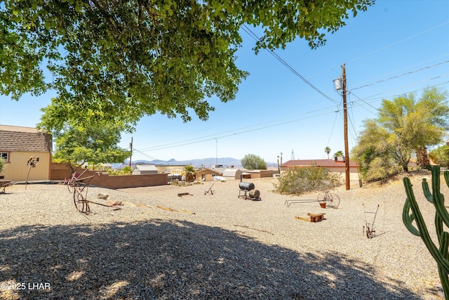 3841 Big Horn Dr, Lake Havasu City, AZ 86406 - view of yard with a mountain view and a storage shed