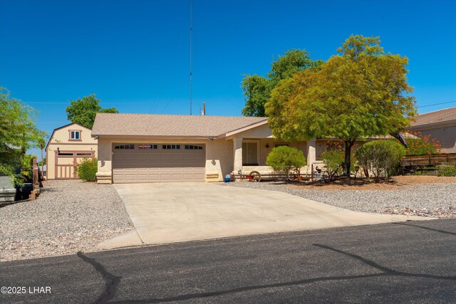 3841 Big Horn Dr, Lake Havasu City, AZ 86406 - view of front of property with an attached garage, concrete driveway, stucco siding, and a shingled roof