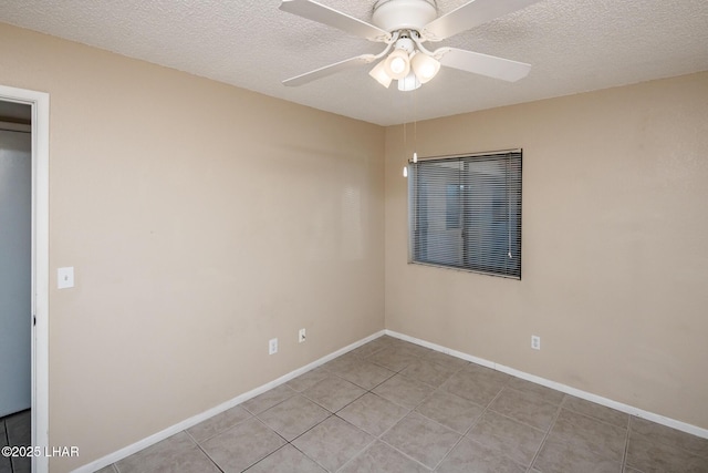 unfurnished room with light tile patterned floors, a textured ceiling, and ceiling fan