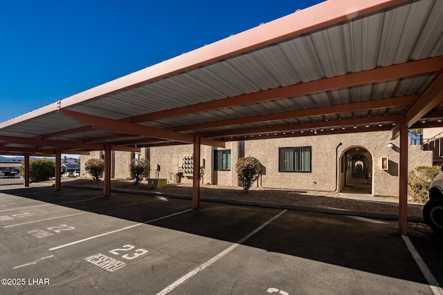 view of vehicle parking featuring a carport