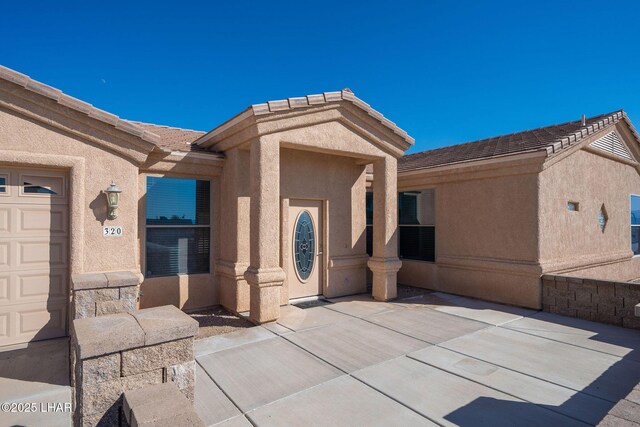 view of patio with a garage