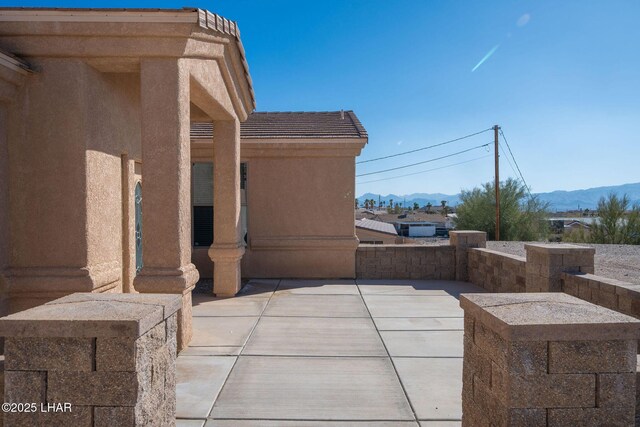 view of patio with a mountain view