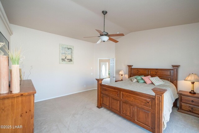 carpeted bedroom with lofted ceiling and ceiling fan