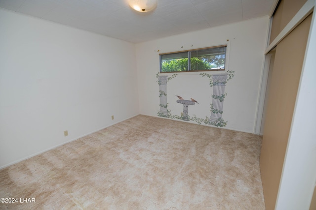 empty room with light colored carpet