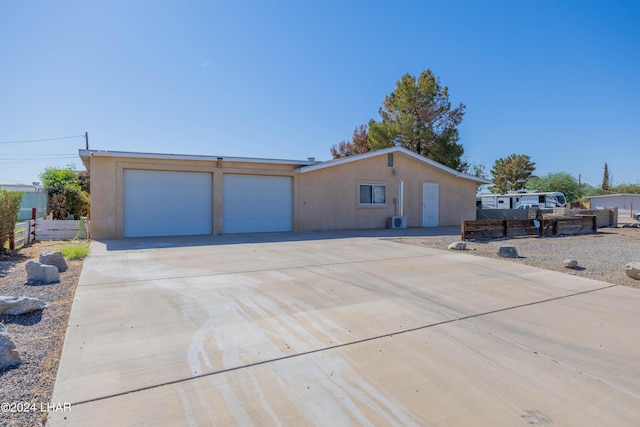 single story home featuring a garage