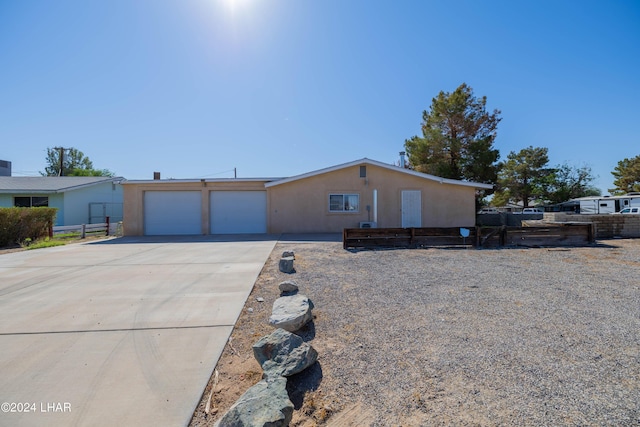 single story home with a garage