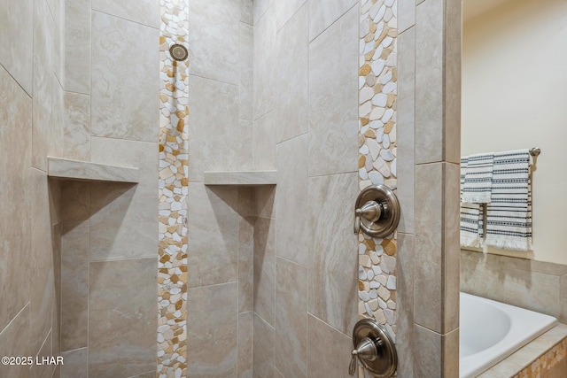 bathroom featuring a bath and tiled shower