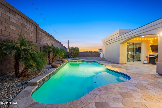 view of swimming pool featuring a patio, a fenced backyard, a fenced in pool, and grilling area