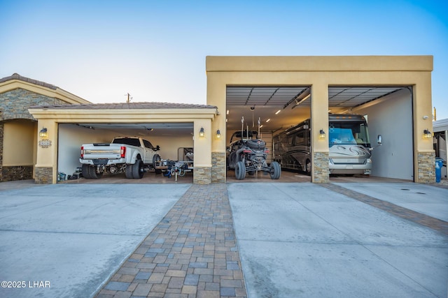 garage with concrete driveway