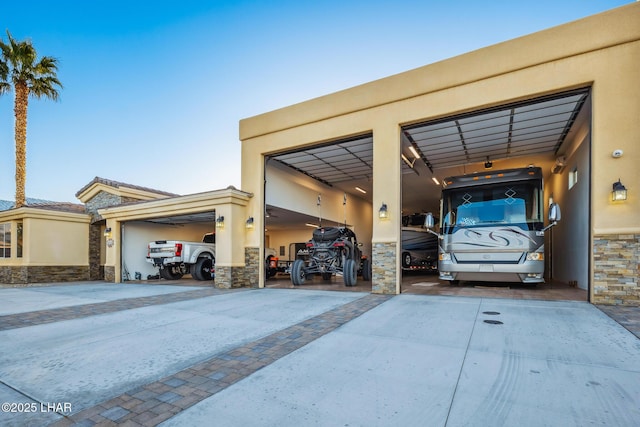 garage featuring concrete driveway