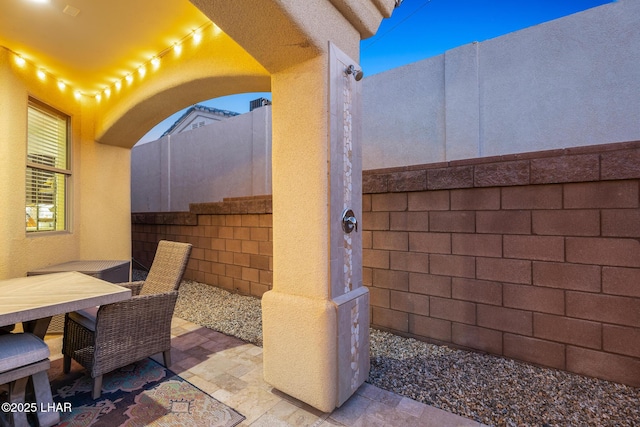 view of patio / terrace with outdoor dining area and fence