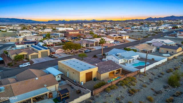 birds eye view of property with a mountain view and a residential view