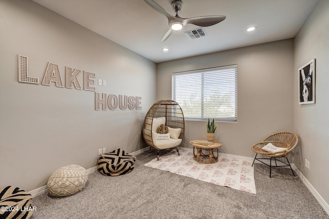 sitting room featuring ceiling fan, baseboards, carpet flooring, and visible vents