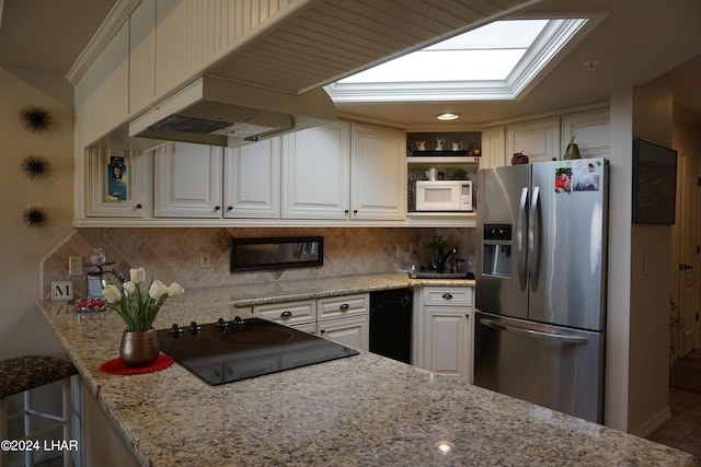 kitchen with light stone counters, stainless steel fridge with ice dispenser, backsplash, and white cabinets